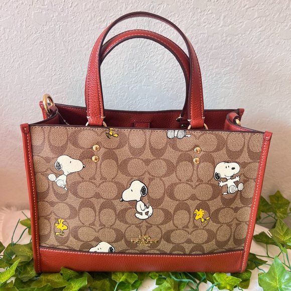 Coach CE862 X PEANUTS DEMPSEY CARRYALL SIGNATURE SNOOPY WOODSTOCK BAG - Picture 1 of 5